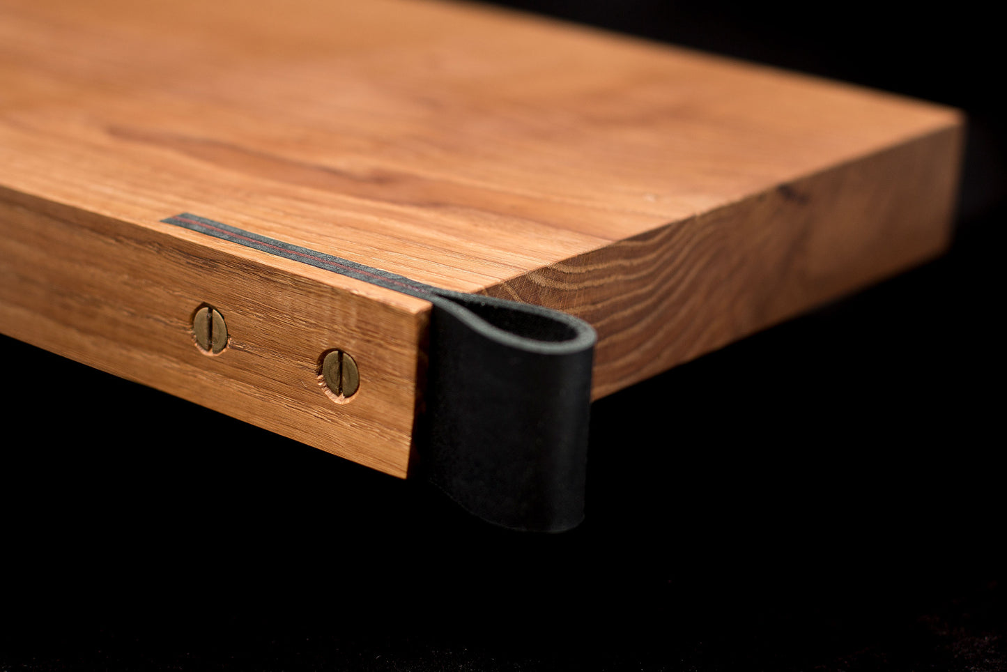 Oak board with leather handle inside